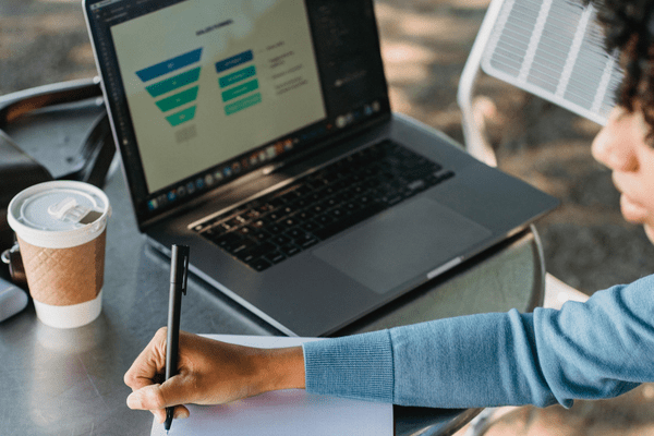 woman working on her marketing funnel
