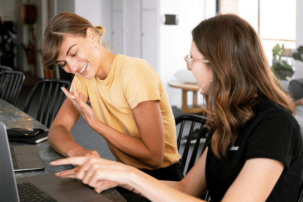 two women working together on their marketing strategy